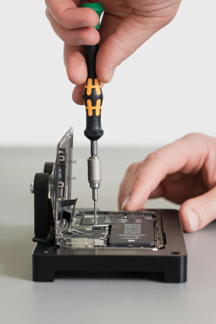 iPhone with the screen removed during screen replacement at Tech Pro Repair in Wilton Manors